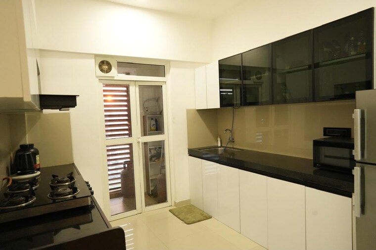 Kitchen, lodha-belmondo 2.5 Bedroom 1800 Sq.Ft. Apartment In Gahunje Pune 10553684