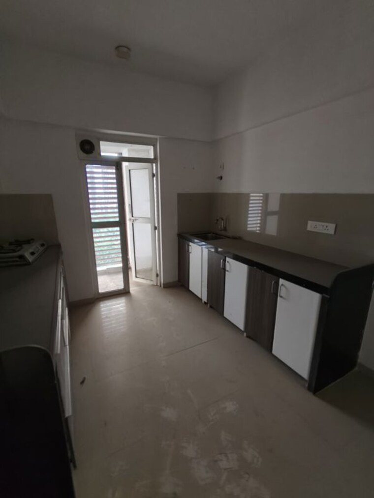 Kitchen, lodha-belmondo 2 Bedroom 1000 Sq.Ft. Apartment In Gahunje Pune 10363106