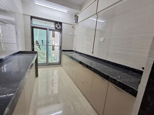 Kitchen in 1 BHK Apartment at Je And Vee Om Trimurti, Malad East – for Sale