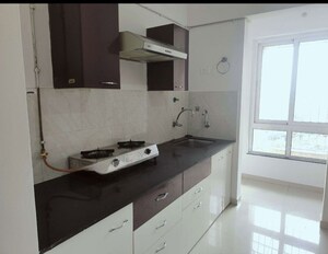 Kitchen in 2 BHK Apartment at Puranik Rumah Bali, Ghodbunder Road – for Sale