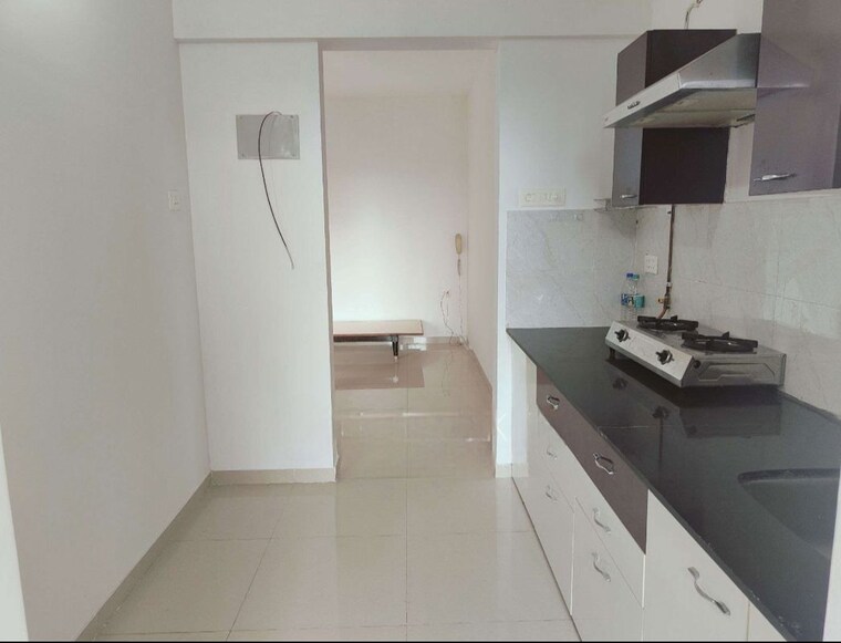 Kitchen, puranik-rumah-bali 2 Bedroom 596 Sq.Ft. Apartment In Ghodbunder Road Thane 10554103