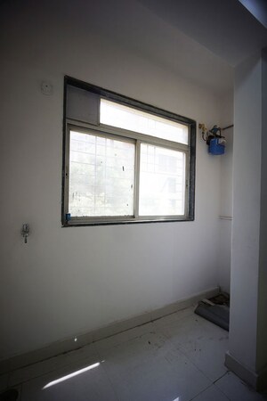 Room in 2 BHK Apartment at Tathawade – for Sale
