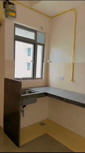 Kitchen in 1.5 BHK Apartment at Piramal Vaikunth, Balkum Pada – for Rent