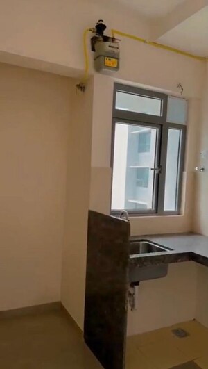 Kitchen in 1.5 BHK Apartment at Piramal Vaikunth, Balkum Pada – for Rent