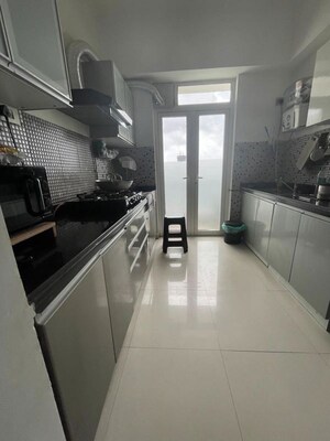 Kitchen in 3 BHK Apartment at Omkar Alta Monte, Malad East – for Rent