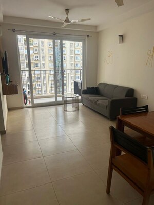 Living Room in 2 BHK Apartment at Bhartiya Nikoo Homes Phase 2, Thanisandra Main Road – for Rent
