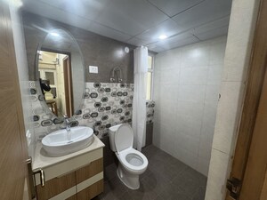 Bathroom in 1 RK Apartment at Logix Blossom Zest, Sector 143 – for Sale