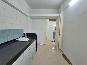 Kitchen in 2 BHK Apartment at Neelkanth Greens, Manpada – for Sale