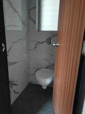 Bathroom in 2 BHK Apartment at Anant Metropolis Insignia Towers, Kasarvadavali – for Rent
