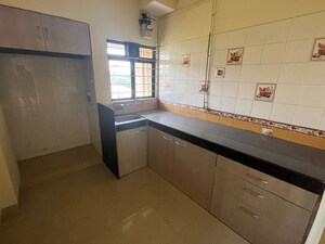 Kitchen in 2 BHK Apartment at Unnati Woods CHS, Kasarvadavali – for Rent