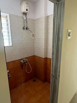 Bathroom in 2 BHK Apartment at Unnati Woods CHS, Kasarvadavali – for Rent