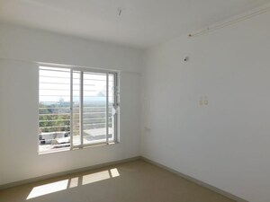 Room in 2 BHK Apartment at Kolte Patil Little Earth, Kiwale – for Rent