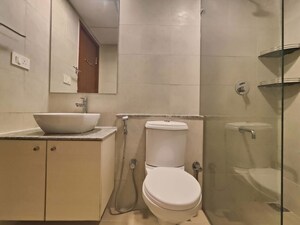 Bathroom in 3 BHK Apartment at Bhartiya Nikoo Homes Phase 2, Thanisandra Main Road – for Rent