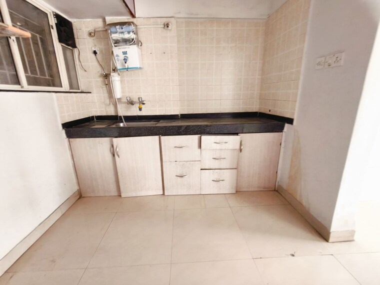 Kitchen, bk-jhala-kapil-woodrow-estate-phase-2 2 Bedroom 1200 Sq.Ft. Apartment In Wanwadi Pune 10446474