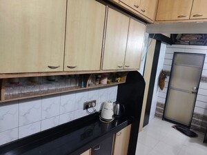 Kitchen in 2 BHK Apartment at Swastik Park CHS, Ghodbunder Road – for Sale