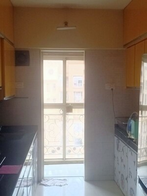 Kitchen in 2.5 BHK Apartment at Rosa Oasis Ph 2, Ghodbunder Road – for Sale