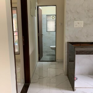 Attached Bathroom in 1.5 BHK Apartment at Royal Eksar Apartment, Roshan Nagar – for Sale