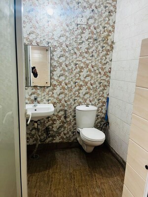 Bathroom in 3 BHK Apartment at Aims Golf City, Sector 75 – for Rent