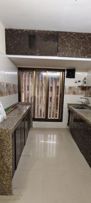 Kitchen in 2 BHK Apartment at Poonam Estate Cluster I, Mira Road – for Rent