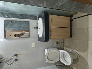 Bathroom in Studio Apartment at Nimbus The Golden Palm, Sector 168 – for Rent