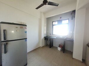 Bathroom in 1 BHK Apartment at Unnati Woods CHS, Kasarvadavali – for Rent