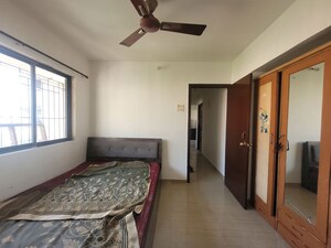 Bedroom in 1 BHK Apartment at Unnati Woods CHS, Kasarvadavali – for Rent