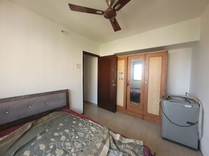 Bedroom in 1 BHK Apartment at Unnati Woods CHS, Kasarvadavali – for Rent
