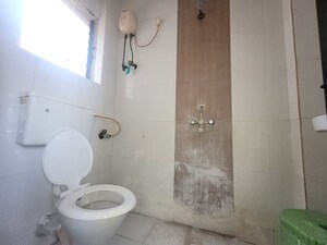 Bathroom in 1 BHK Apartment at Unnati Woods CHS, Kasarvadavali – for Rent