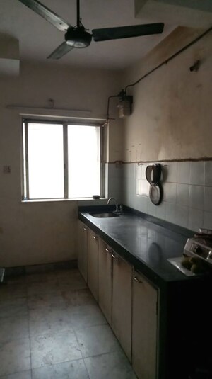 Kitchen in 1 BHK Apartment at Vrindavan Akshaya CHS, Vrindavan Society – for Sale
