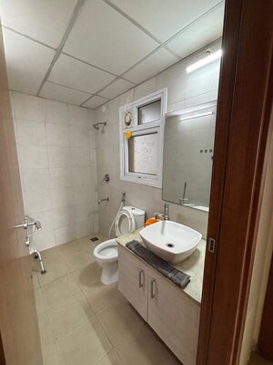 Bathroom in 3 BHK Apartment at Bhartiya Nikoo Homes, Thanisandra Main Road – for Rent