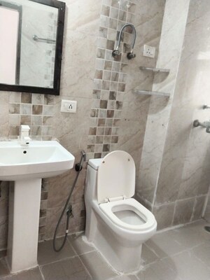 Bathroom in 2 BHK Apartment at Aims Golf City, Sector 75 – for Rent