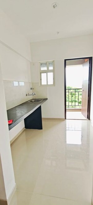 Kitchen in 1 BHK Apartment at Nyati Defence Enclave, Undri – for Rent