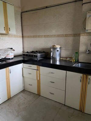Kitchen in 2 BHK Apartment at Vikash Complex CHS, Uthalsar – for Rent