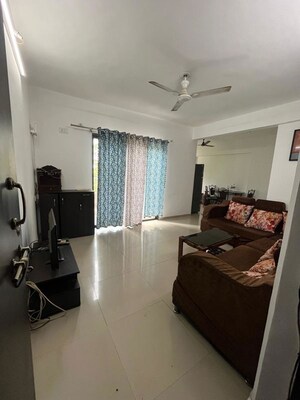 Living Room in 2 BHK Apartment at Satyam Serenity, Wadgaon Sheri – for Rent
