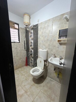 Bathroom in 2 BHK Apartment at Satyam Serenity, Wadgaon Sheri – for Rent