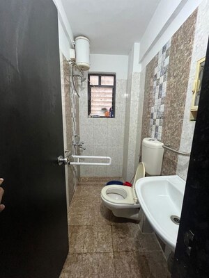 Bathroom in 2 BHK Apartment at Satyam Serenity, Wadgaon Sheri – for Rent