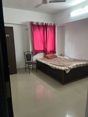 Bedroom in 2 BHK Apartment at Satyam Serenity, Wadgaon Sheri – for Rent