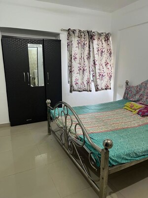 Bedroom in 2 BHK Apartment at Satyam Serenity, Wadgaon Sheri – for Rent