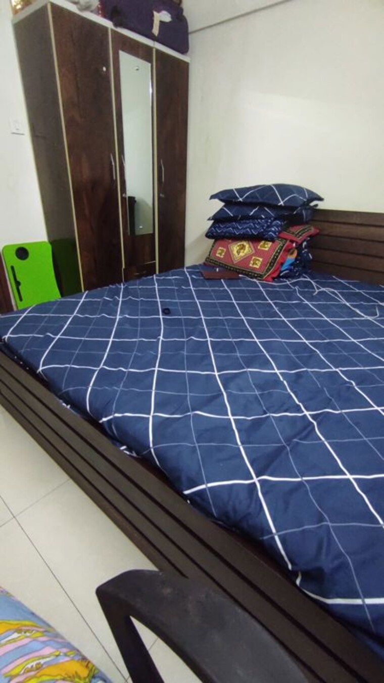 Bedroom, magarpatta-city-zinnia 1 Bedroom 800 Sq.Ft. Apartment In Hadapsar Pune 10558397