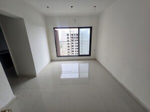 Living Room in 1 BHK Apartment at Shwetambara CHS, Kandivali West – for Sale