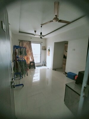Living Room in 1 BHK Apartment at Kini Tower, Virar West – for Sale