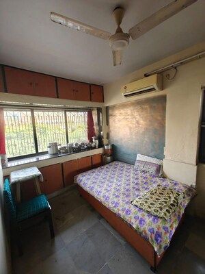Bedroom in 2 BHK Apartment at Satellite Garden, Goregaon East – for Rent