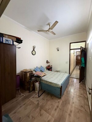 Bedroom in 2 BHK Builder Floor at Nehru Enclave – for Rent