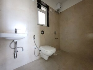 Bathroom in 2 BHK Apartment at Puranik City Reserva, Ghodbunder Road – for Rent