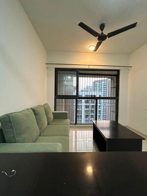 Living Room in 1 BHK Apartment at Lodha Crown Quality Homes, Majiwada – for Rent