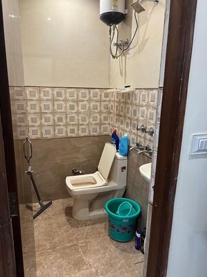 Bathroom in 2 BHK Apartment at Raheja Navin Minar, Patel Nagar – for Rent