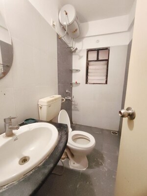 Bathroom in 3 BHK Apartment at Kolte Patil Margosa Heights, Mohammadwadi – for Rent