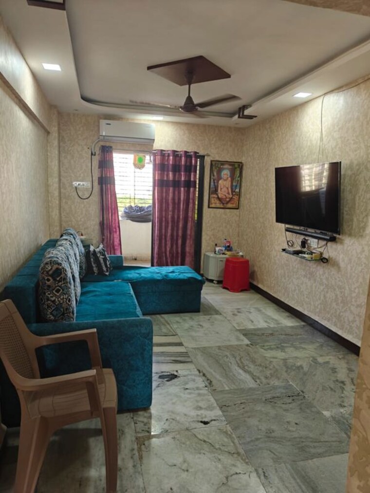 Living Room, indradhanu-palace-chs 2 Bedroom 910 Sq.Ft. Apartment In Uthalsar Thane 10560418