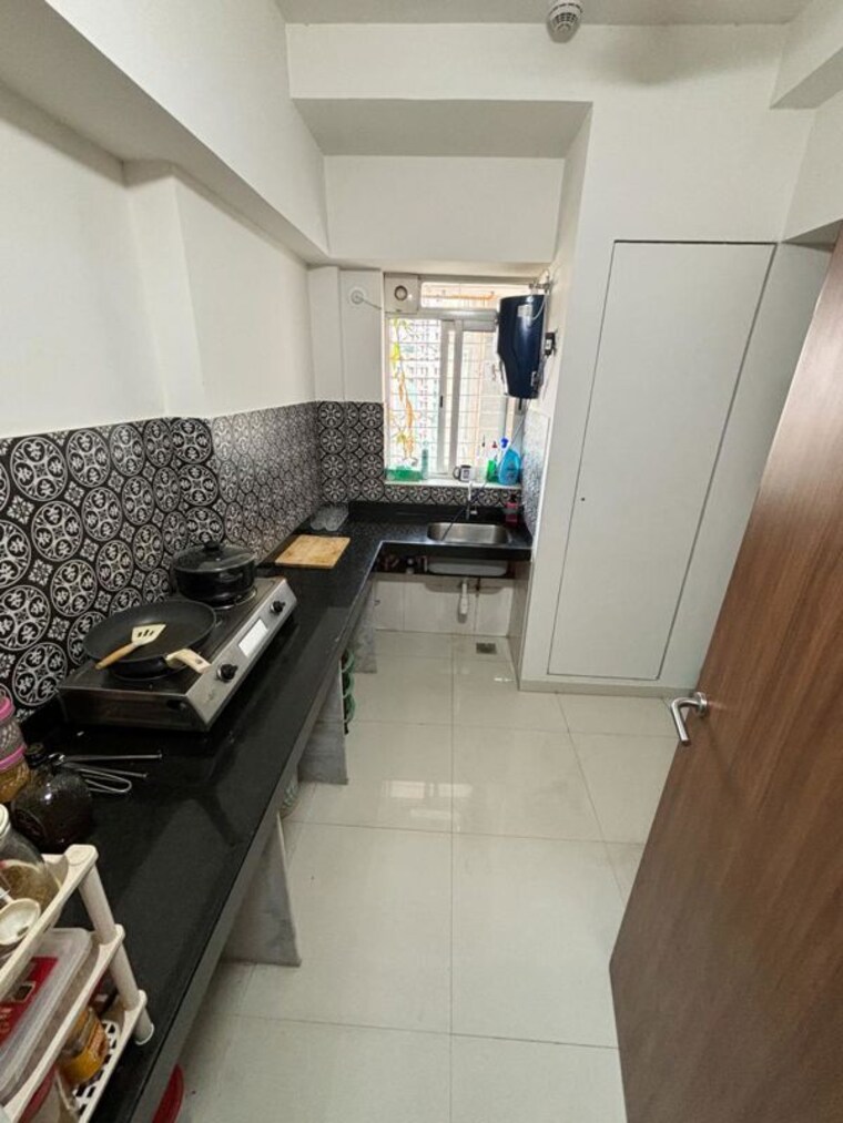 Kitchen, lodha-amara 1.5 Bedroom 700 Sq.Ft. Apartment In Kolshet Road Thane 10560656