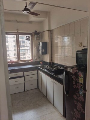 Kitchen in 2 BHK Apartment at Royal Classic Co Op Society, Andheri West – for Rent